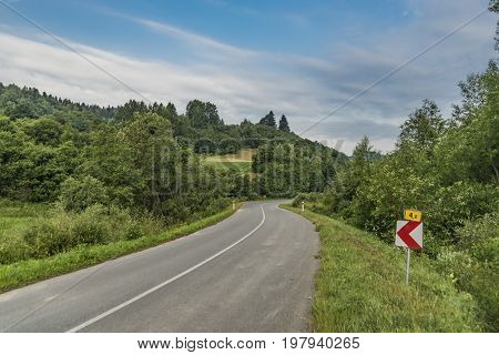 Road near Lesnica village in Pieniny national park in cold summer morning