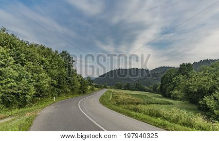 Road near Lesnica village in Pieniny national park in cold summer morning