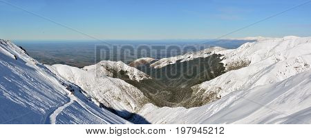 Panoramic landscape view of The Canterbury Plains from the Mount Hutt Ski Field in New Zealand.