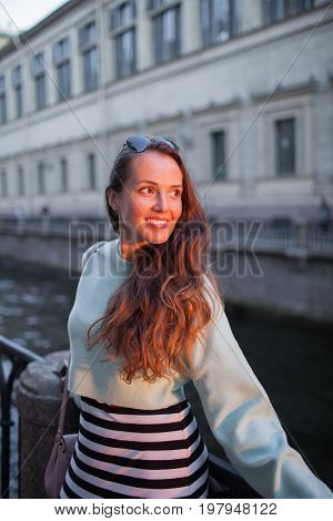 Attractive And Stylish Young Girl Standing In The Light Of The Setting Sun