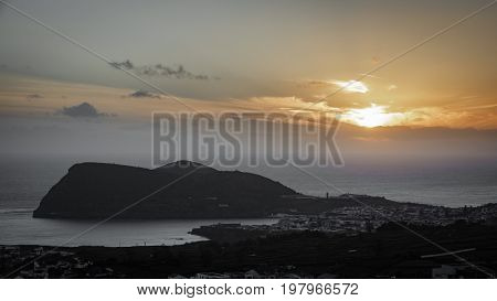 Long shot sunset over Angra do Heromismo and Brazil mountain