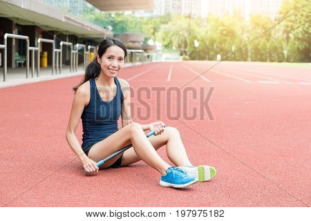 Sport woman using roller stick massage for her legs