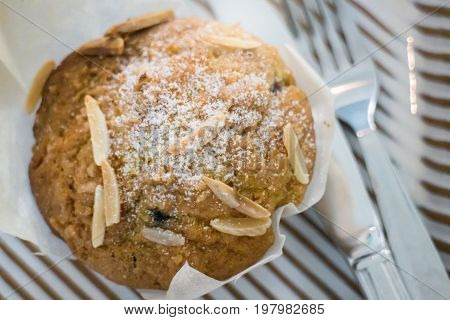 Blueberry muffin serving with knife and fork stock photo