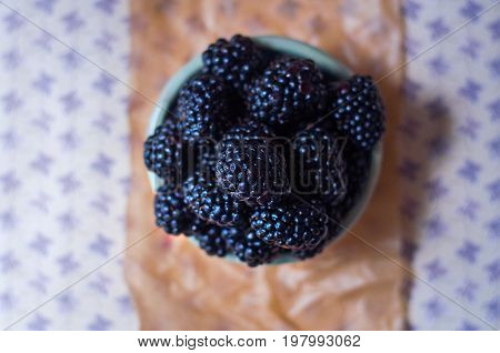 Homemade, sweet, delicious blackberries in a handmade dish
