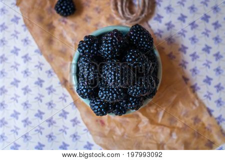 Homemade, sweet, delicious blackberries in a handmade dish