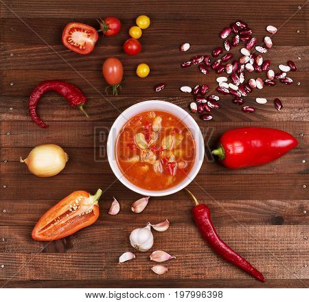 Tom Yum Goong Spicy Sour Soup on wooden table top view Thai local food