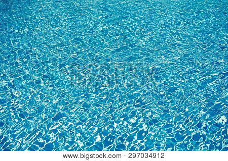 Sea Background Texture. Small Blue Waves. Swimming Courses. Transparent Clear Water In Swimming Pool