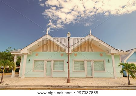 Book Now Pay Later. Houses Little Cute Apartments Tropic Island With Palm Trees On Sunny Summer Day.