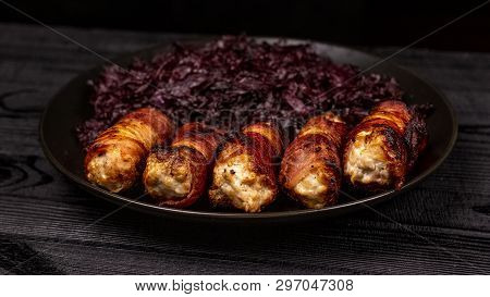 Fried Homemade Grilled Sausages Or Chevapchichi With Stewed Sauerkraut On A Wooden Rustic Background