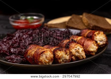 Fried Homemade Grilled Sausages Or Chevapchichi With Stewed Sauerkraut, And Slices Of Rye Bread And 