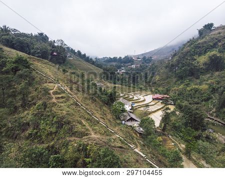 Aerial View Of Green Terraced Rice Fields And Building On The Valley At Cat Cat Village In Sapa, Vie