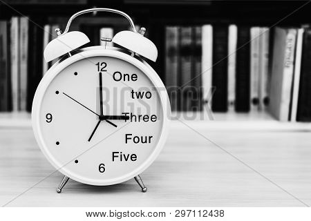 Big Bracket Clock With The Alarm Clock A Closeup Is Located On A Table In An Office On An Indistinct