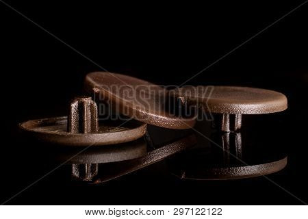 Group Of Three Whole Brown Plast Masking Plugs Work Item Isolated On Black Glass