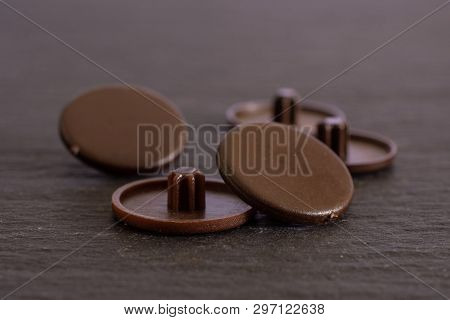 Group Of Five Whole Brown Plast Caplugs Work Item On Grey Stone