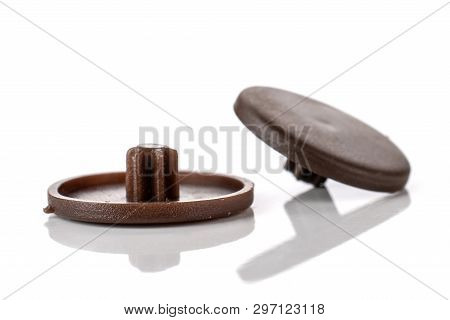 Group Of Two Whole Brown Plast Caps Work Item Isolated On White Background
