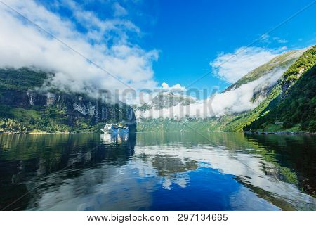Hurtigruten Cruise Liner Sailing On The Geirangerfjord, One Of The Most Popular Destination In Norwa