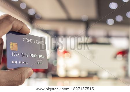Man Holding Credit Card For Blurred Bokeh Background E-shopping Marketing Digital, Consumer Purchase