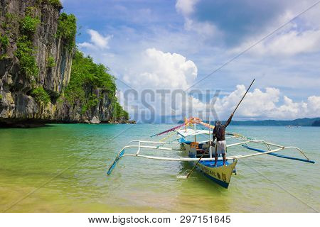Puerto Princesa, Palawan, Philippines - September 26, 2018: Filipino Boat On Azure Coast Waiting Tou