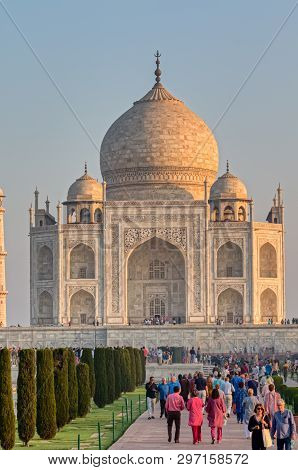 Agra, India - March 5 2018: Tourists Sighteseeing, Exploring And Admiring Famous The Taj Mahal