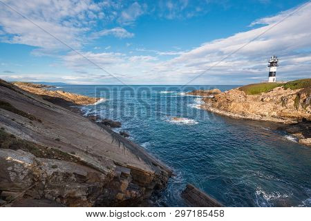 Pancha Island Lighthouse In Ribadeo Coastline, Galicia, Spain.