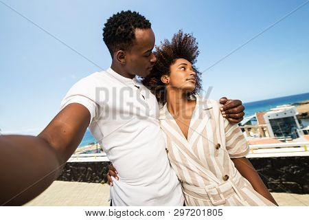 Outdoor Protrait Of Black African American Couple  Taking A Selfie