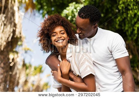 Outdoor Protrait Of Black African American Couple Embracing Each Other