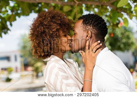 Outdoor Protrait Of Black African American Couple Kissing Each Other