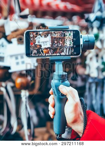 Germany, Nuremberg - December 17, 2018: Close-up Of Man Blogger Hands Shooting Video On Smartphone I
