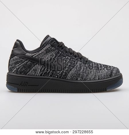 Vienna, Austria - August 7, 2017: Nike Air Force 1 Flyknit Low Black And White Sneaker On White Back