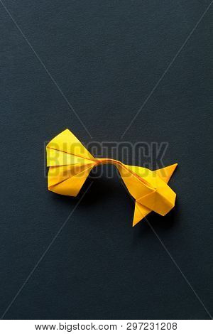 Handmade Paper Craft Origami Gold Koi Carp Fish On Black Background.top View