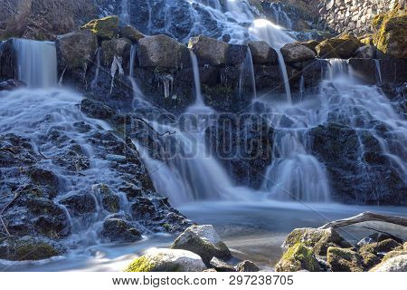 Beautful Waterfall In Blue Shades In The Swedish Village Rottle During Spring