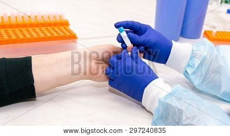 Blood Test In The Laboratory. Finger Blood Scarification.
