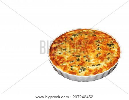 Shpinach and soft cheese pie quiche served on white pan on white backgroud. Close up