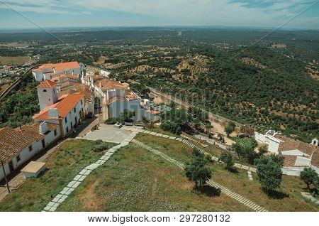 View Of The Small Village Main Street And Countryside Landscape With Green Hills At Evoramonte. A Ti