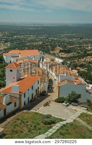 View Of The Small Village Main Street And Countryside Landscape With Green Hills At Evoramonte. A Ti