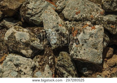 Close-up Of Wall Made Of Rough Stones Covered By Moss And Lichens, Forming A Singular Pattern At Evo