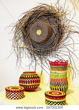 Authentic Panama Hat Or Paja Toquilla Hat And Colored Baskets, Traditional Weaving From Straw, Cuenc
