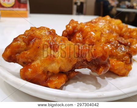 Korean Food Style, Top View Of Spicy Chicken On White Plate In Restaurant, Yangnyeom Tongdak Is Kore