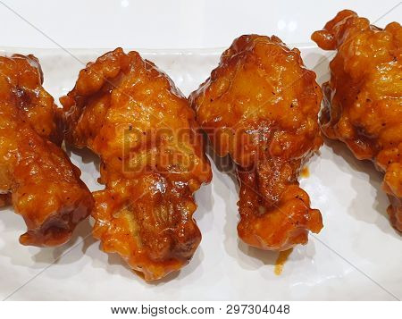 Korean Food Style, Top View Of Spicy Chicken On White Plate In Restaurant, Yangnyeom Tongdak Is Kore