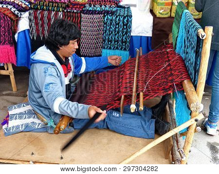 Cuenca, Ecuador - April 14, 2017: Ecuadorian Man Is Weaving Scarf Or Macana By Hand With Cotton Thre