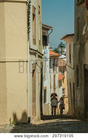 Castelo De Vide, Portugal - July 10, 2018. Two Little Girls Walking Up The Alley Among Old Houses At
