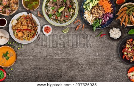 Asian food background with various ingredients on rustic stone background , top view. Vietnam and Thai cuisine.