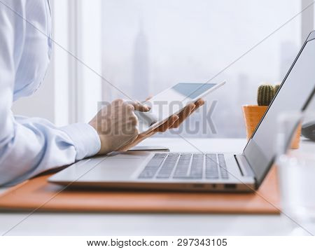 Corporate Businesswoman Using A Digital Tablet