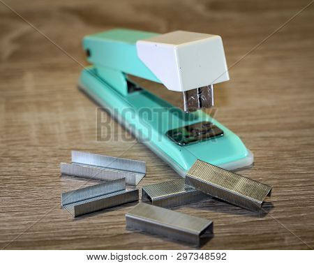 An Old Green Tacker With Spare Cramps