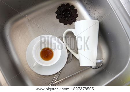 Washing Up. White Coffee Cups In The Kitchen Sink.