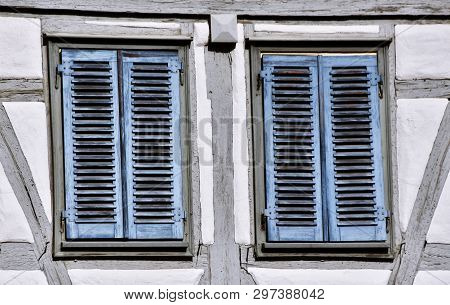 Close Up Of Blue Shutters On Old Timbered House