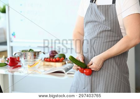 Cheerful Chef Showing Sexy Food Vegetable Erection. Man In Apron Joking At Culinary Blog. Comic Male