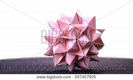Stellated Origami Ball On White Background. Spiky Origami Decoration. Modular Cardboard Product. Ori