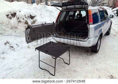 Suv Car In Silver Color With Opened Trunk And Table For Picnic Near It After Cleaning Before Sale In