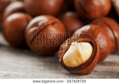 Macadamia Nut On A Wooden Table In A Bag, Closeup, Top View